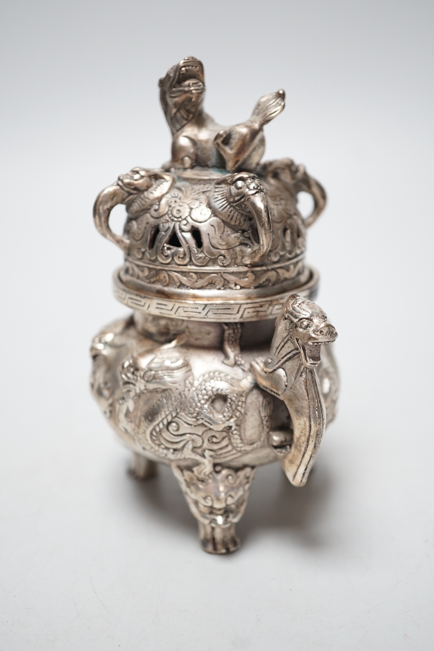 A Chinese cast metal censer and cover, seal mark to base. 13cm tall